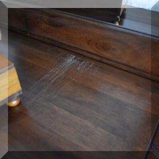 F43. Scratching to top of dresser